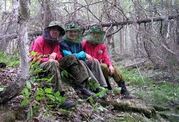 People in protective clothing.